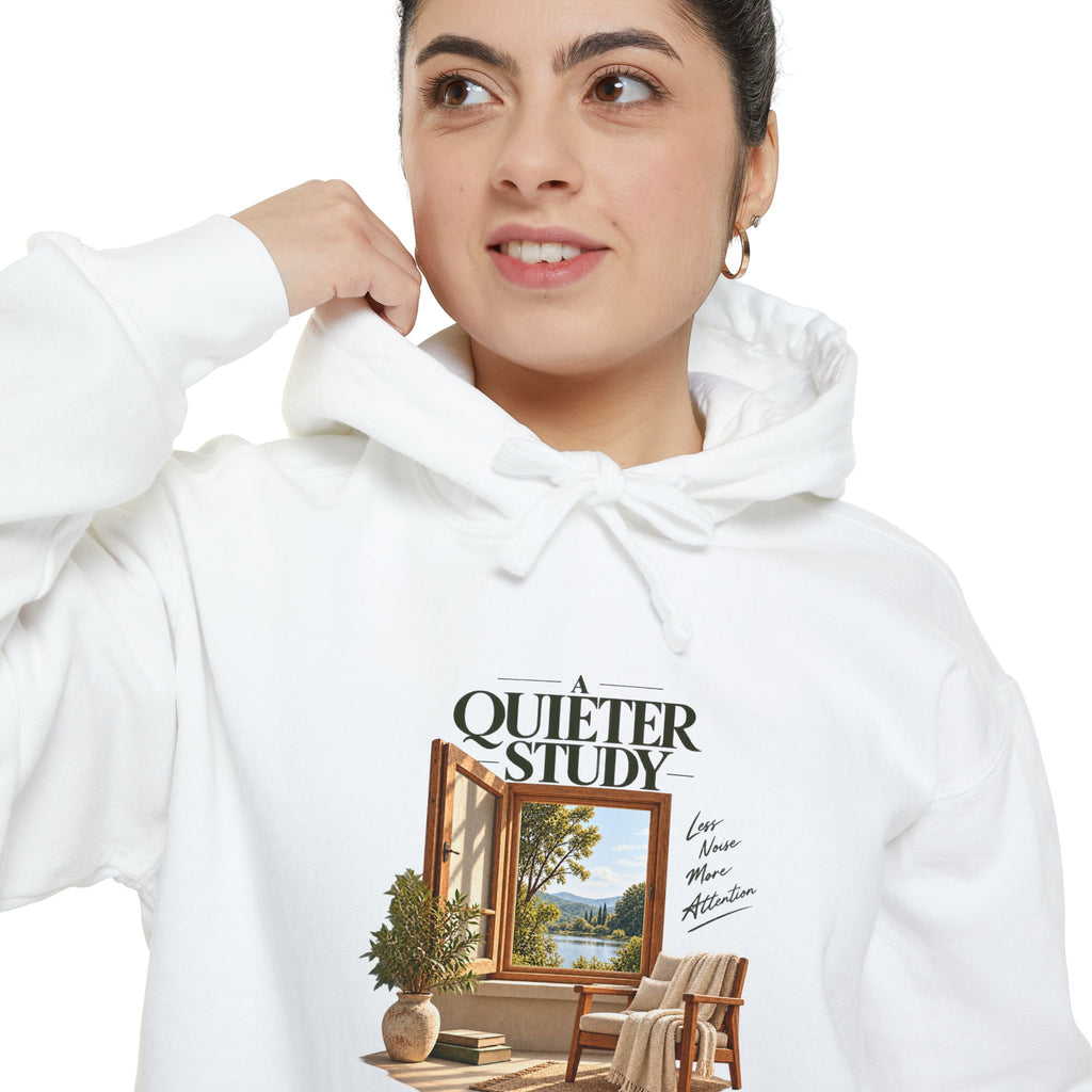 A Quieter Study White garment-dyed hoodie, close-up of the front print on a model, showing the window, chair and plant graphic.