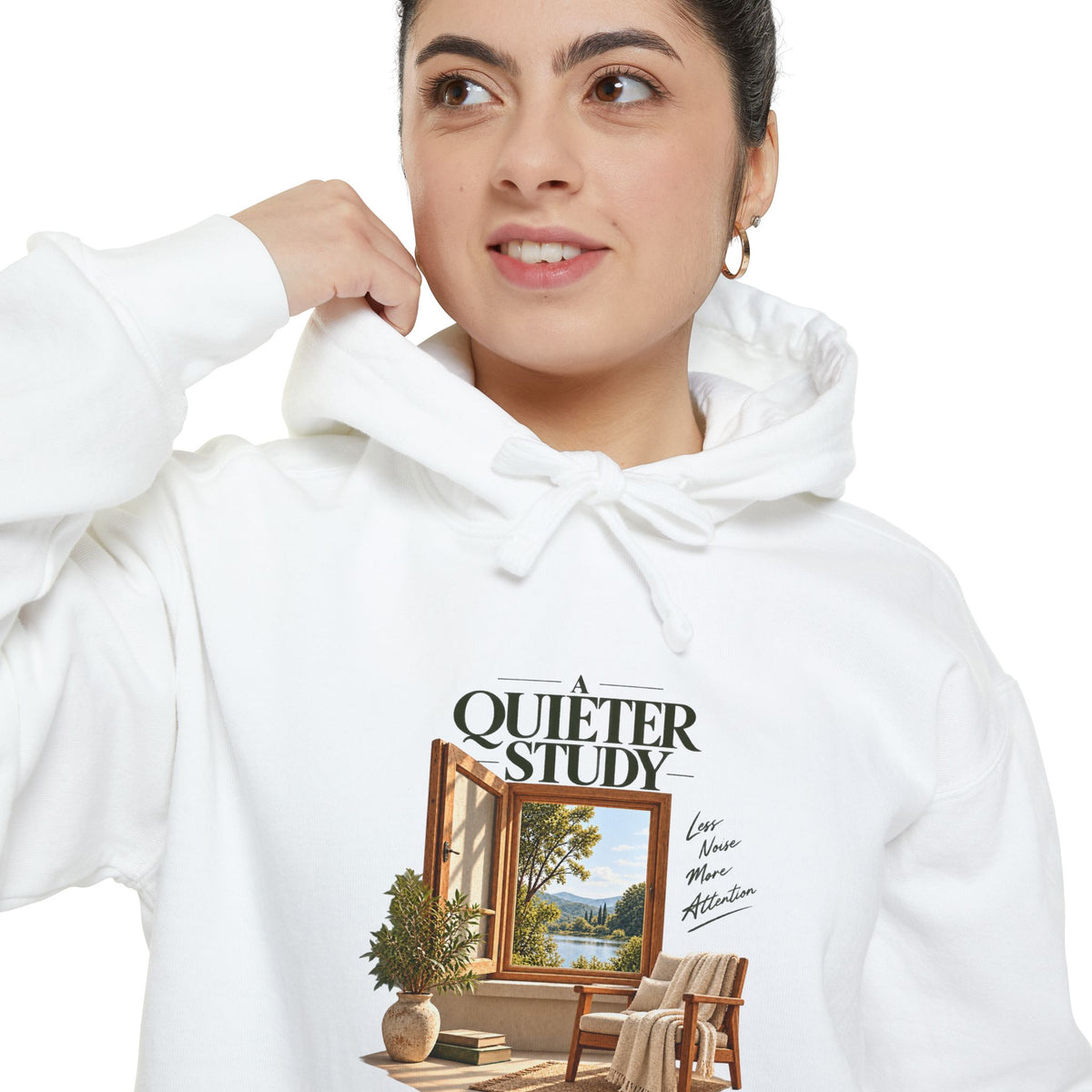 A Quieter Study White garment-dyed hoodie, close-up of the front print on a model, showing the window, chair and plant graphic.