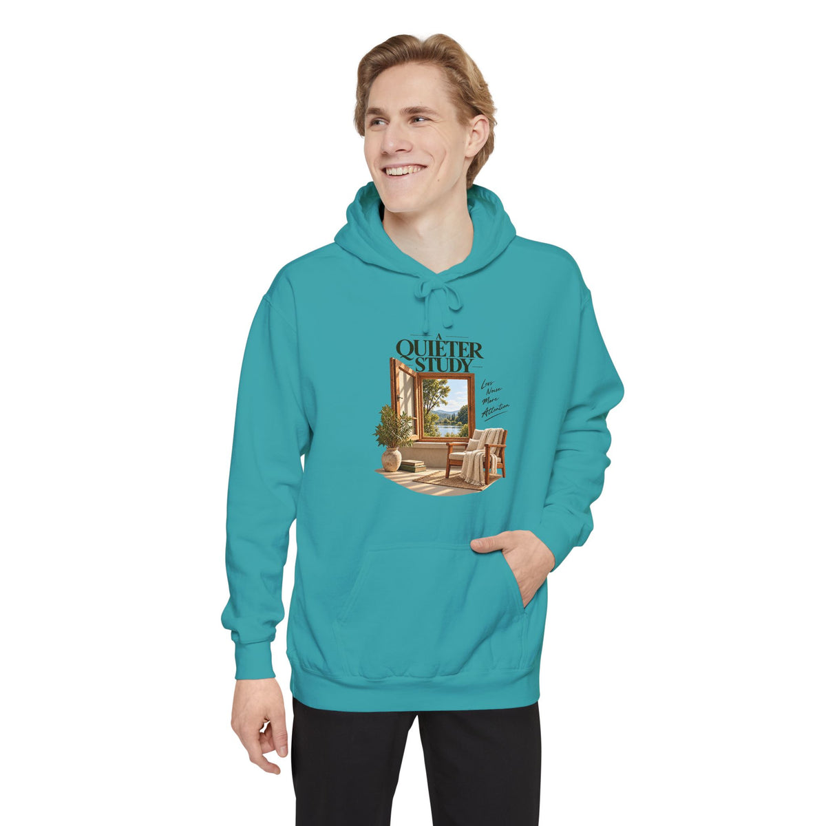 A Quieter Study Seafoam garment-dyed hoodie, modeled front view, showing the window, chair and plant graphic.